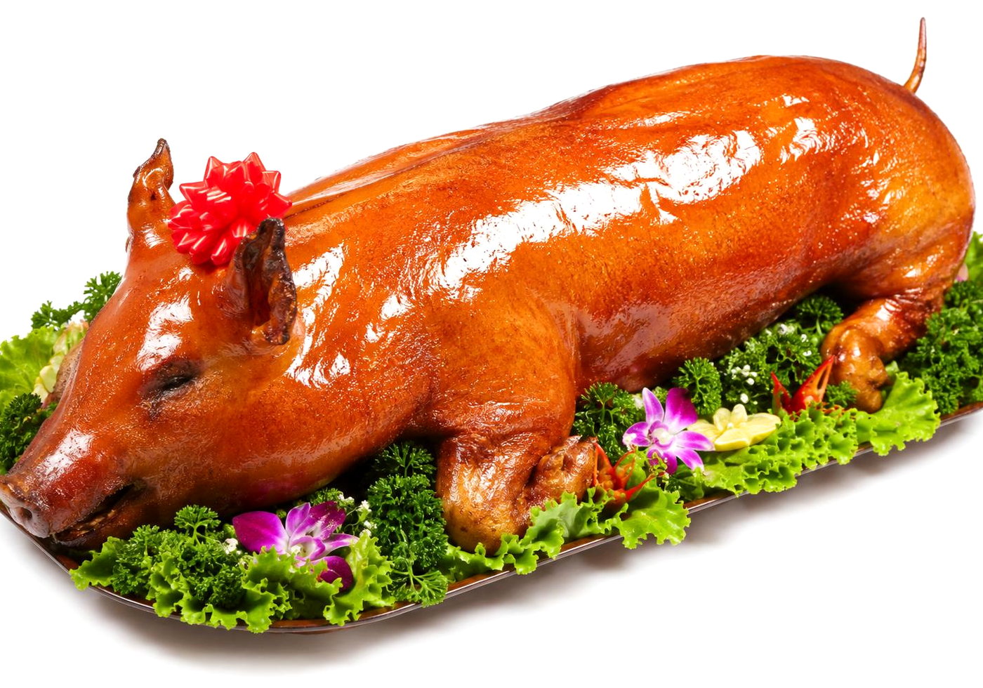 A Guan Chee roasted suckling pig on a garnished platter